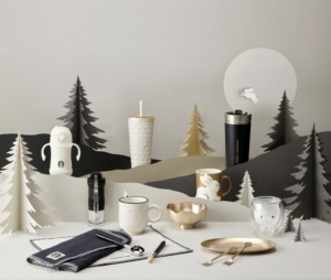 A collection of Starbucks tumblers and mug in white, gold and black colors
