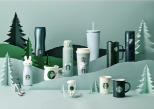 A collection of Starbucks tumbler with green colors on a light green background