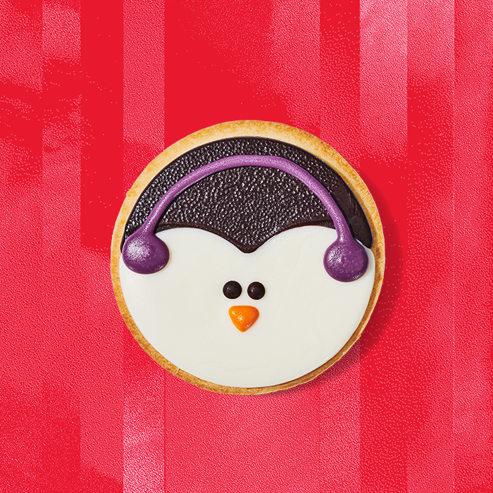 Starbucks penguin cookie on a red background