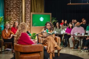 Oprah having a conversation with the author and the audience