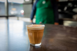 A small glass of Starbucks Cortado on the counter