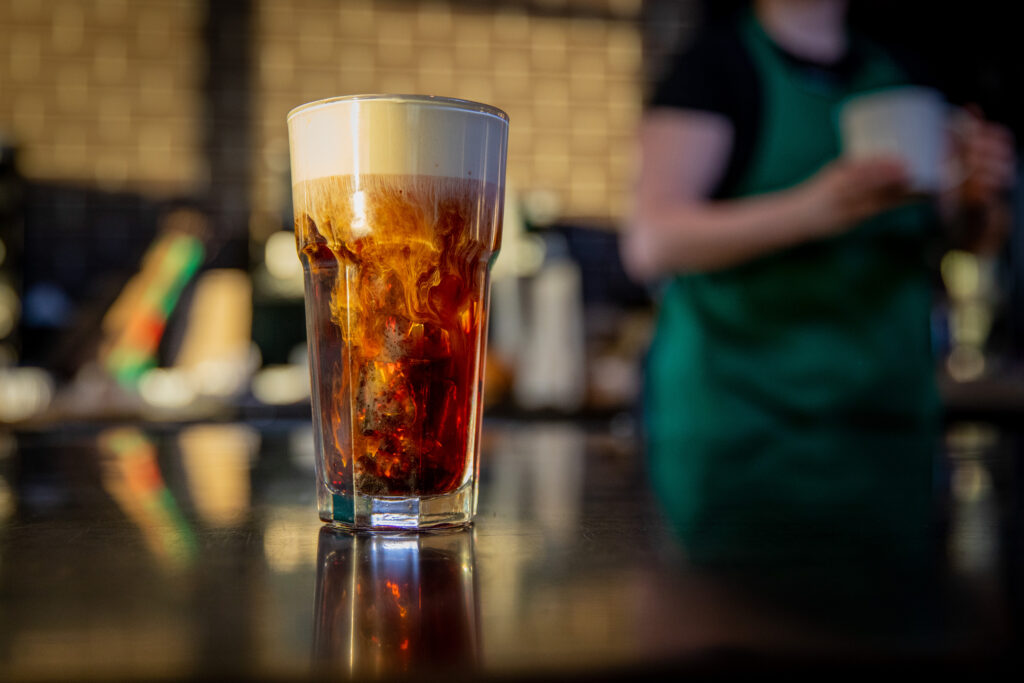 Pistachio Cream Cold Brew in a glass over the counter