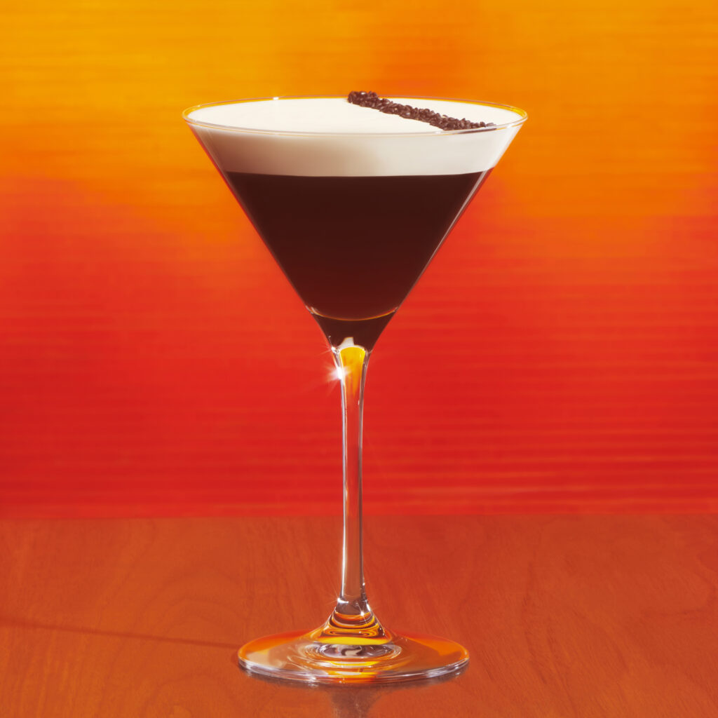 Starbucks hot honey espresso martini on an orange background