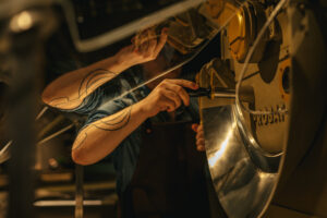 A Starbucks partner roasting coffee at the Roastery in Chicago