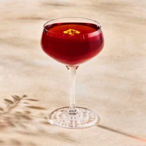 Starbucks Reserve Sakura Blossom Negroni in a glass with a with red color