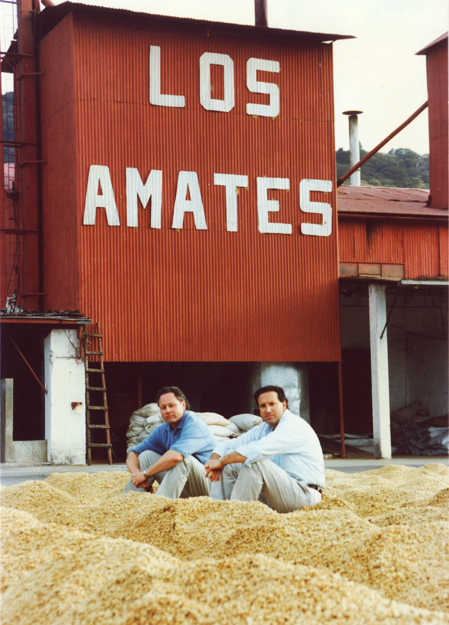 Two men sitting.