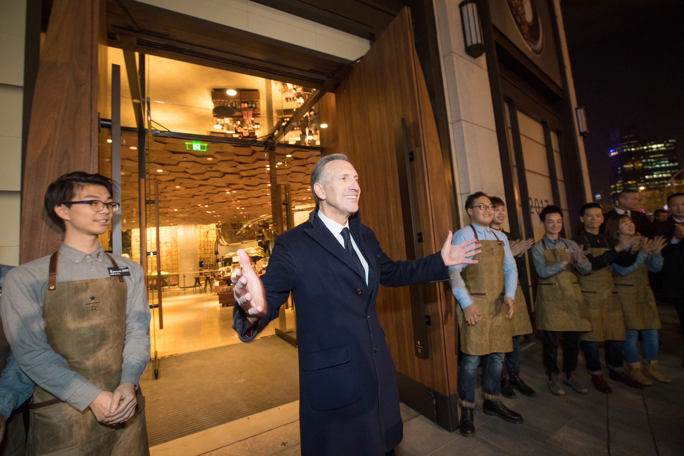 Welcoming gesture outdoors.