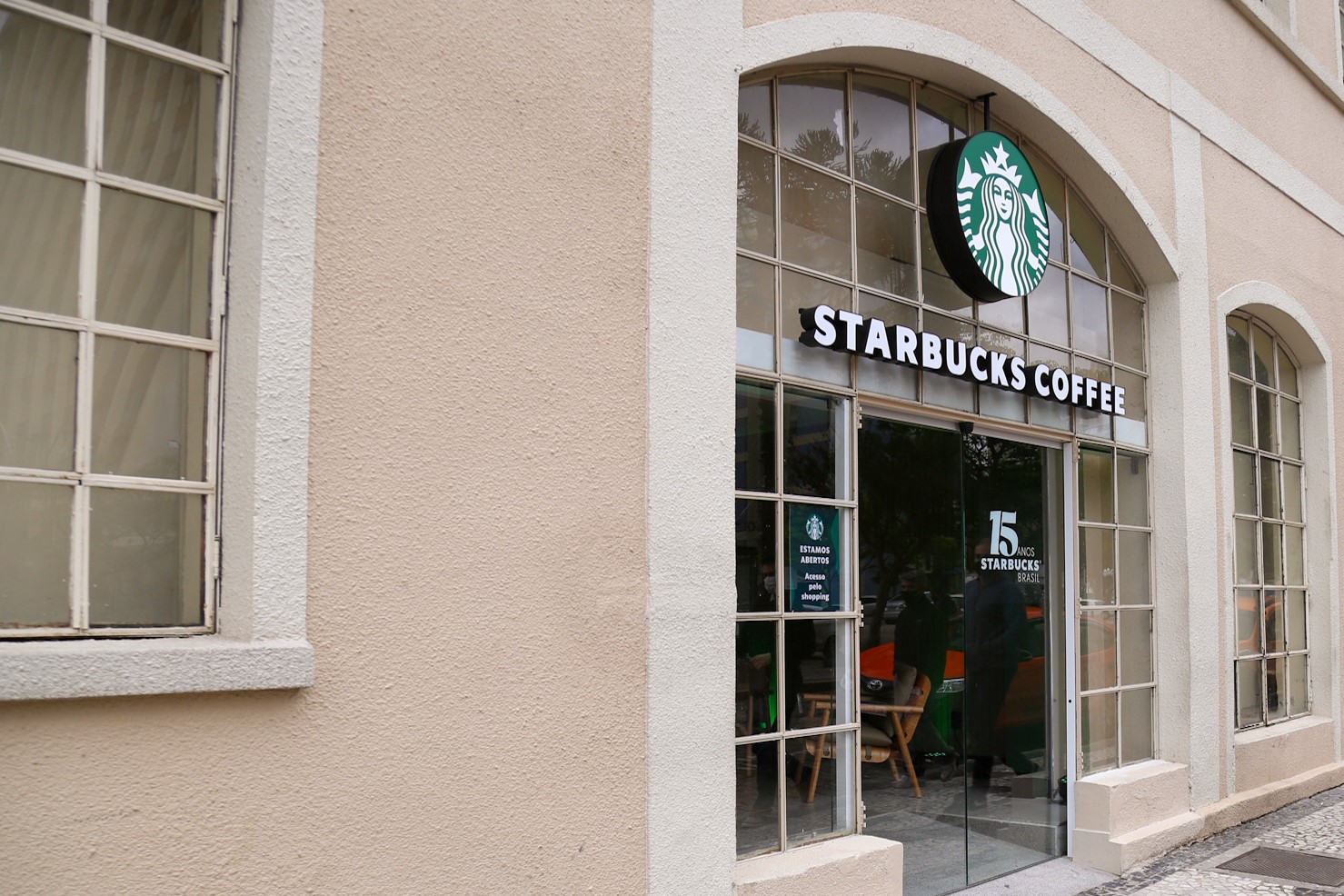 Entrance of Brazil Parana store - pink building with glass door
